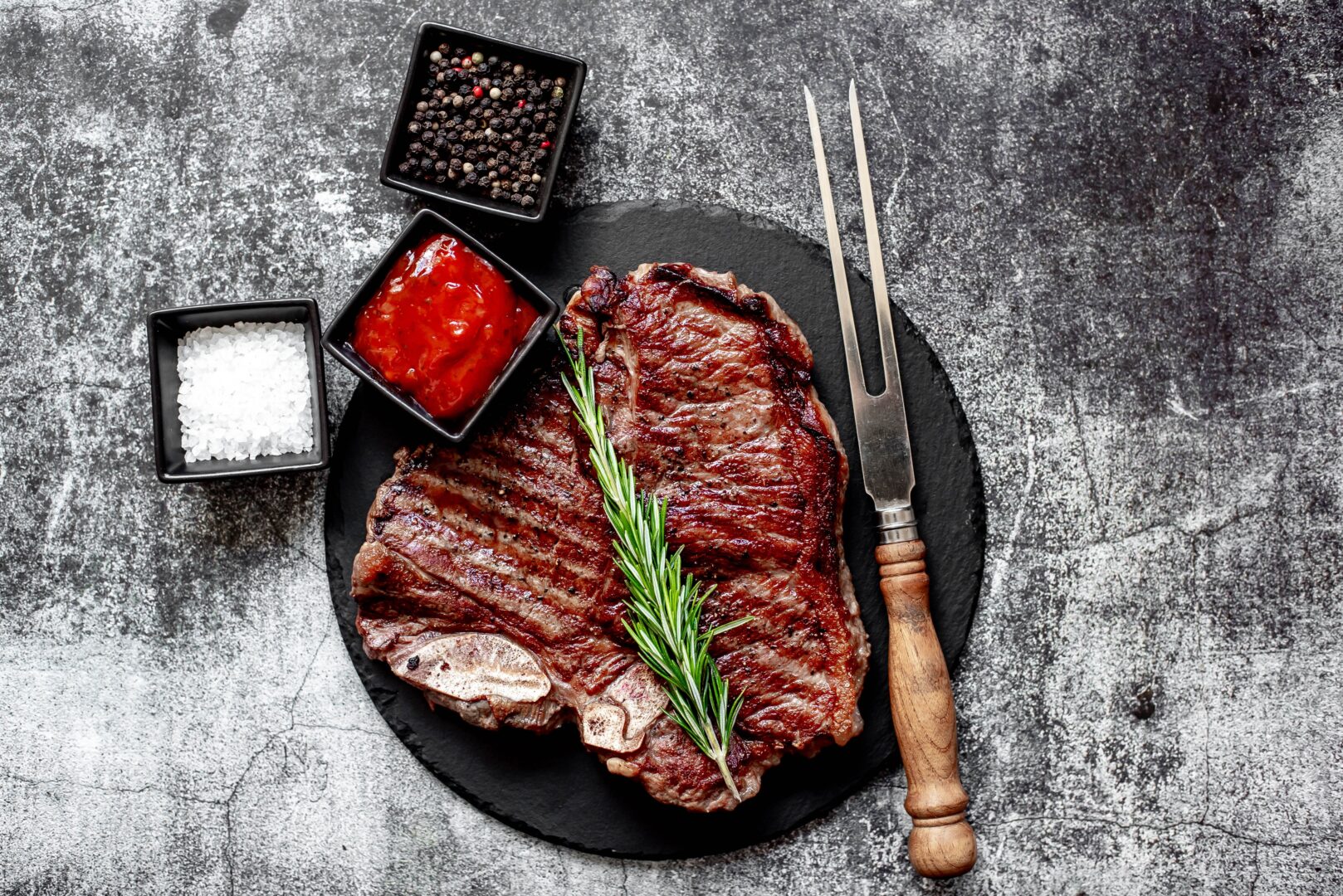 Grilled,T-bone,Steak,On,Stone,Background